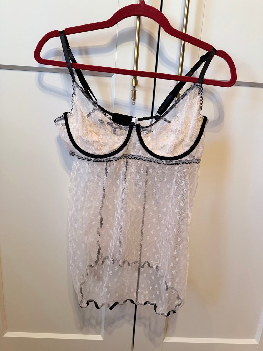 white sheer babydoll with black piping and heart pattern
